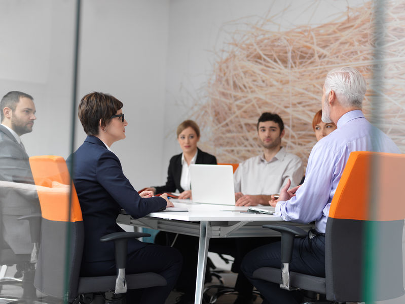 Private Investigation Services as six staff members discuss a due diligence investigation. 