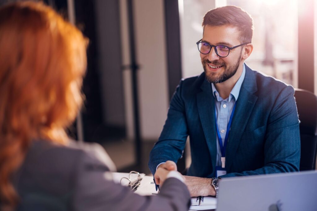 Surveillance services for child support and spousal support cases as a lawyer shakes his clients hand after using evidence from the surveillance investigator.