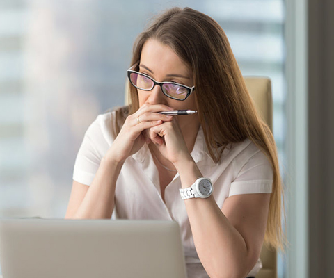 A woman in heavy contemplation as she considers private investigator Vancouver agency services.